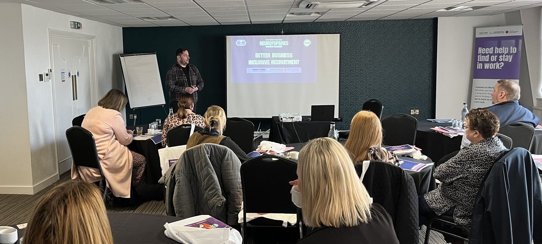 Photo showing employers attending a training session